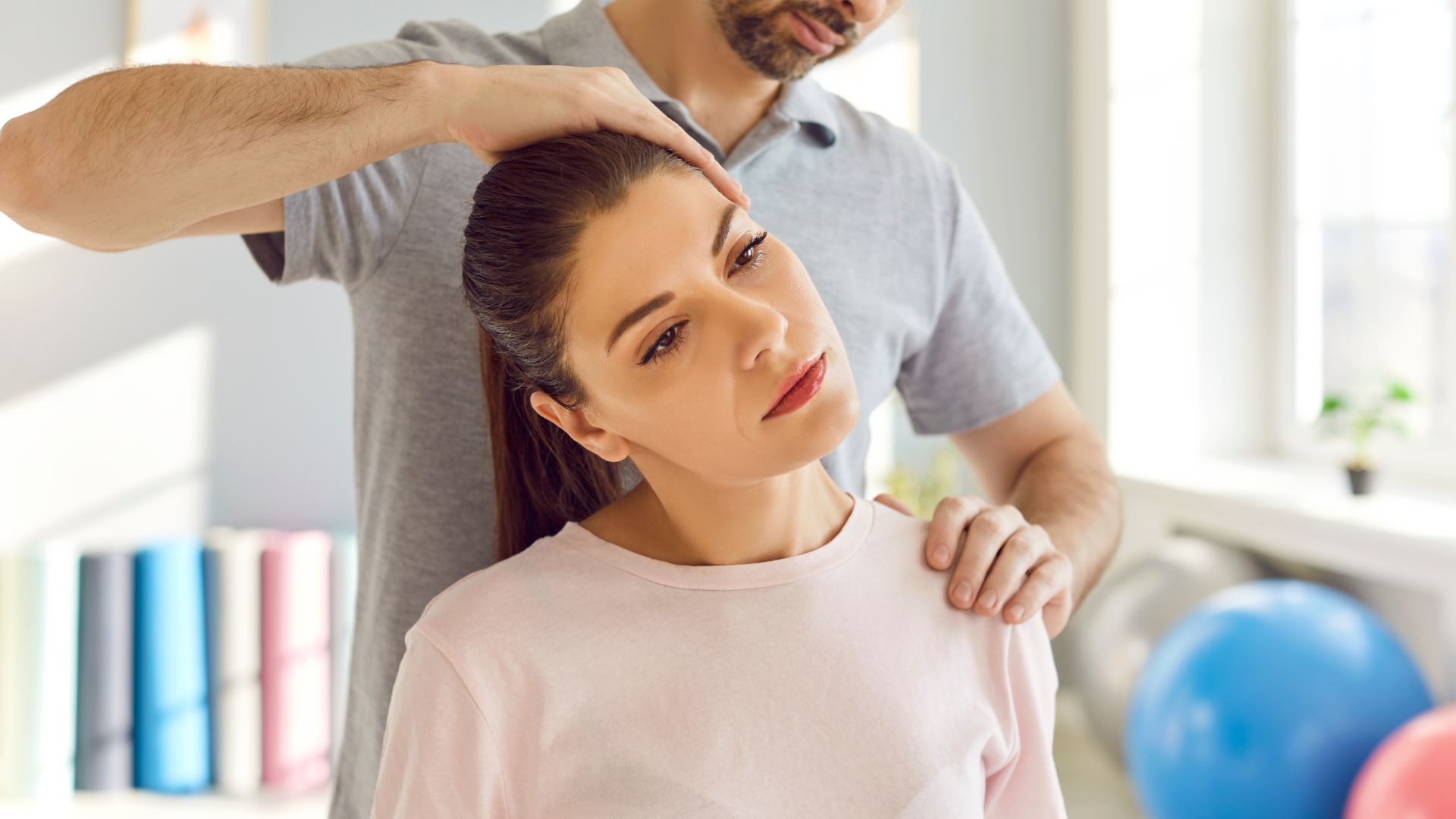 A man combing a woman's hair in a room