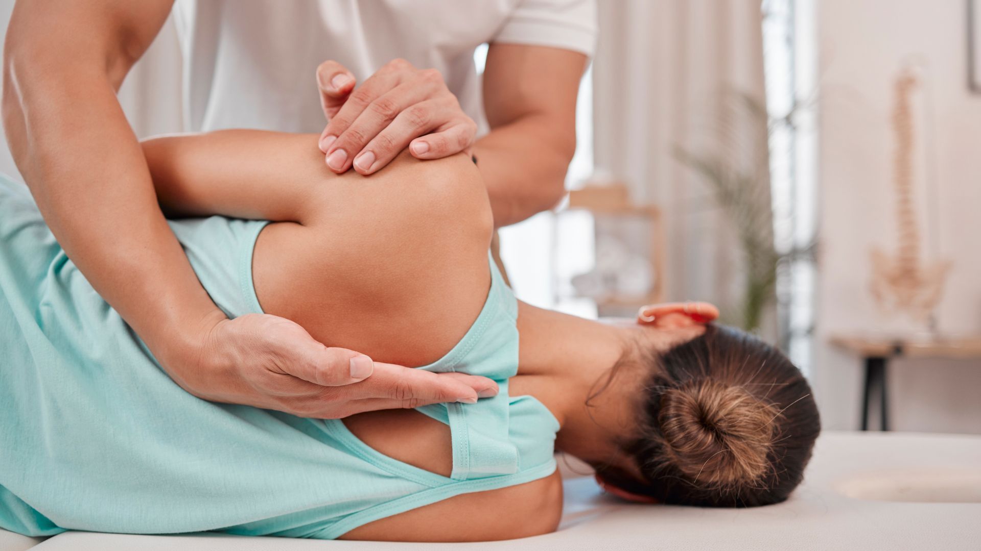 A woman getting a back massage in a room